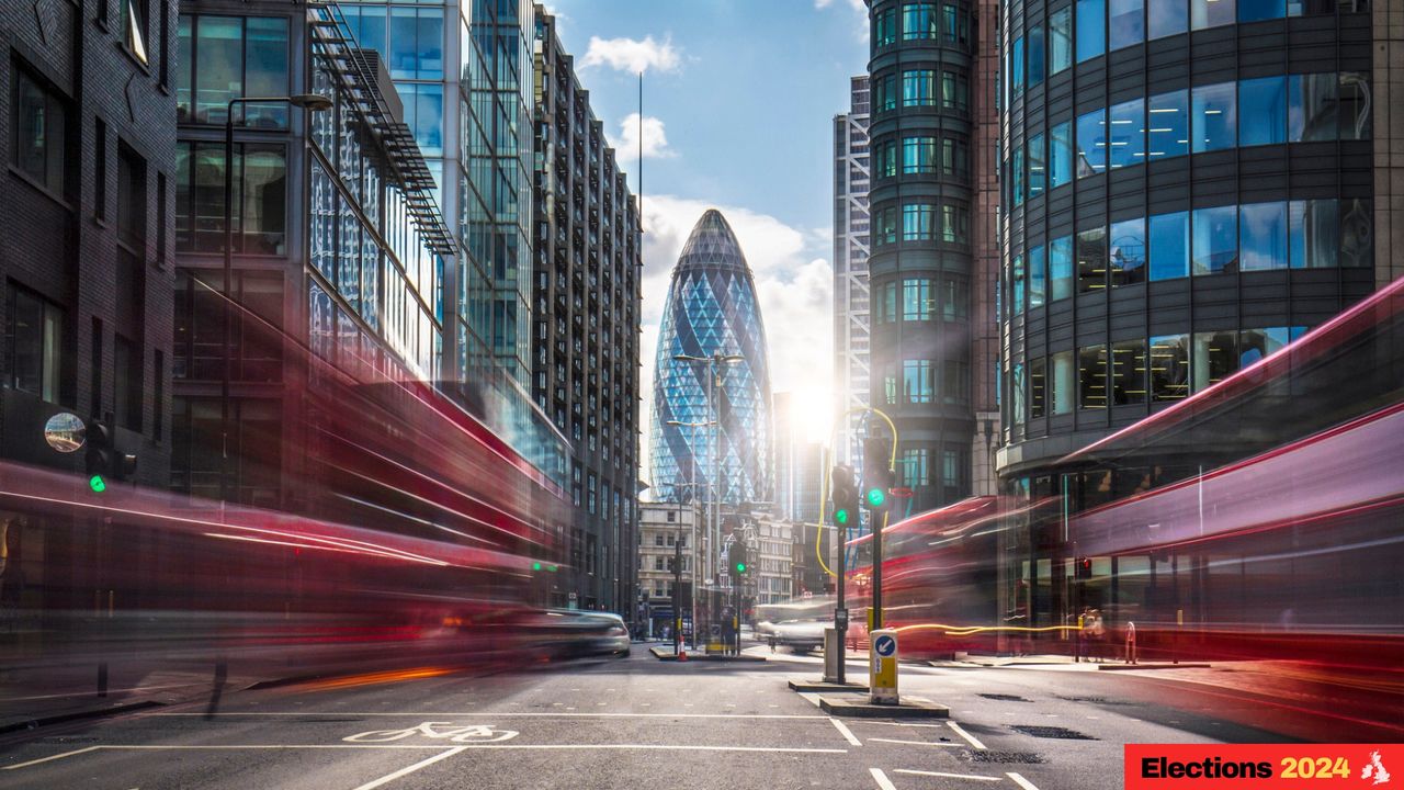 Buses on the street in the financial district of London.