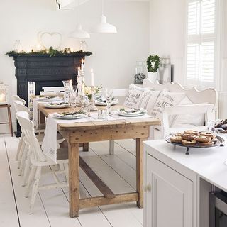 dining area with dining table and chairs with white wall