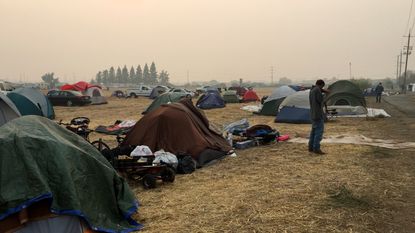 Fire evacuees camp at a parking lot in Chico, California.