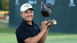 Kevin Yu with the Sanderson Farms Championship trophy