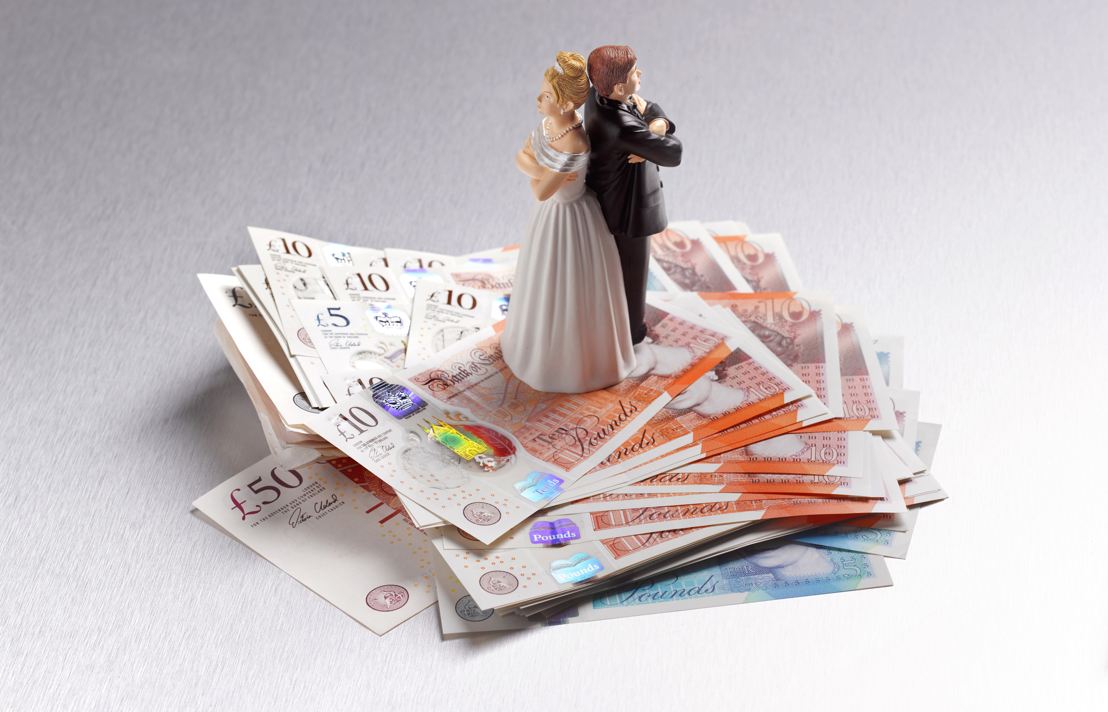 Divorcing couple on a pile of cash