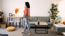 Woman walking on tip toes across living room floor, representing the ageing test