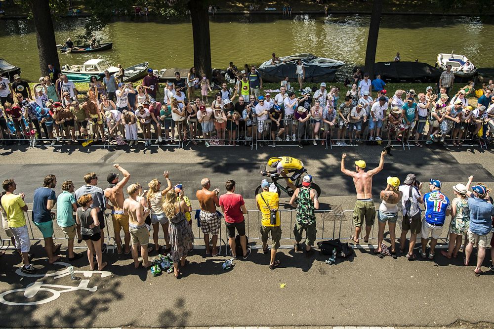 A LottoNL-Jumbo rider in action among the fan-lined course.