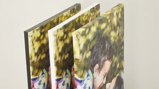 Three canvas prints in a rack