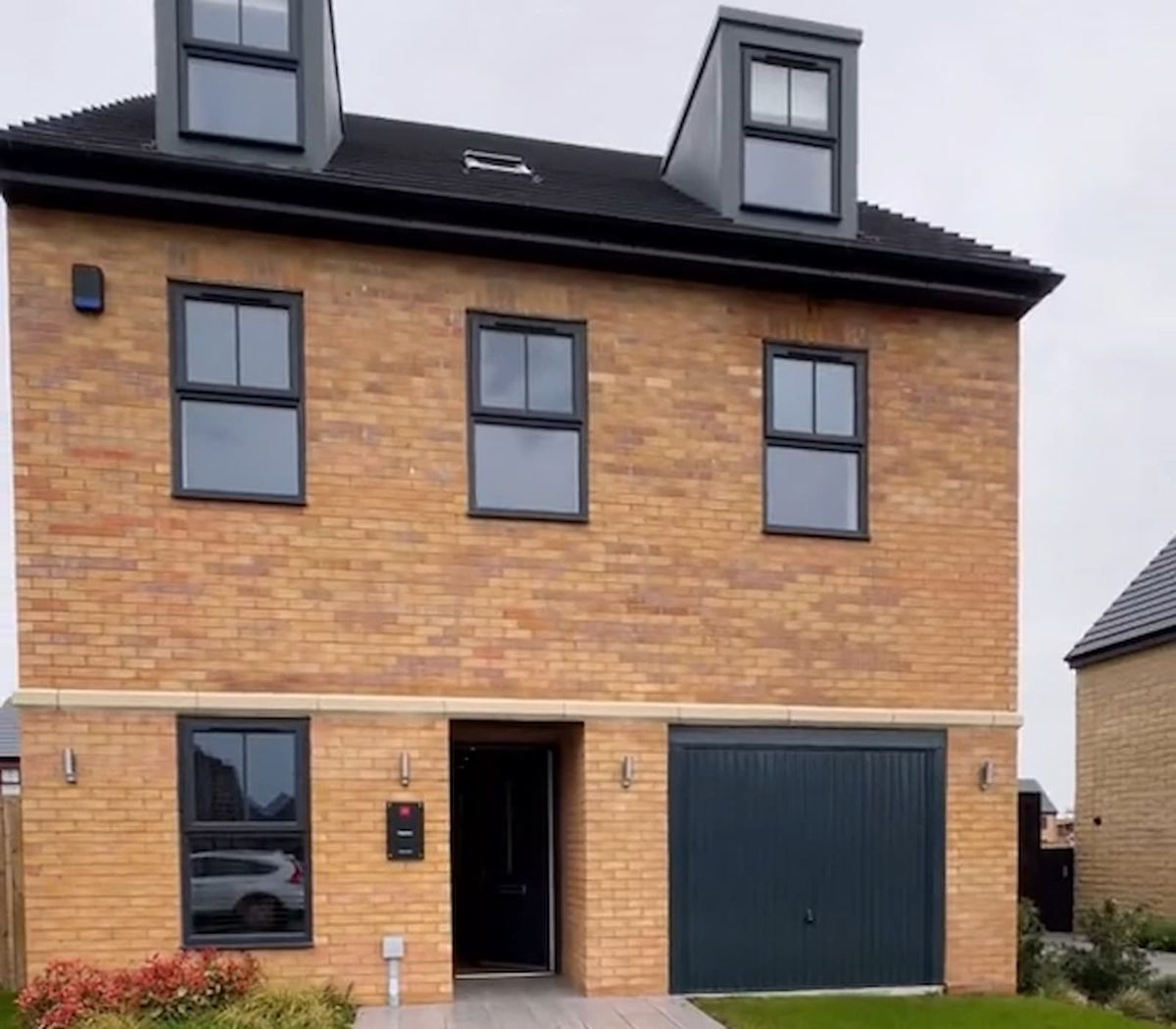 A new build house with an integrated garage with no driveway