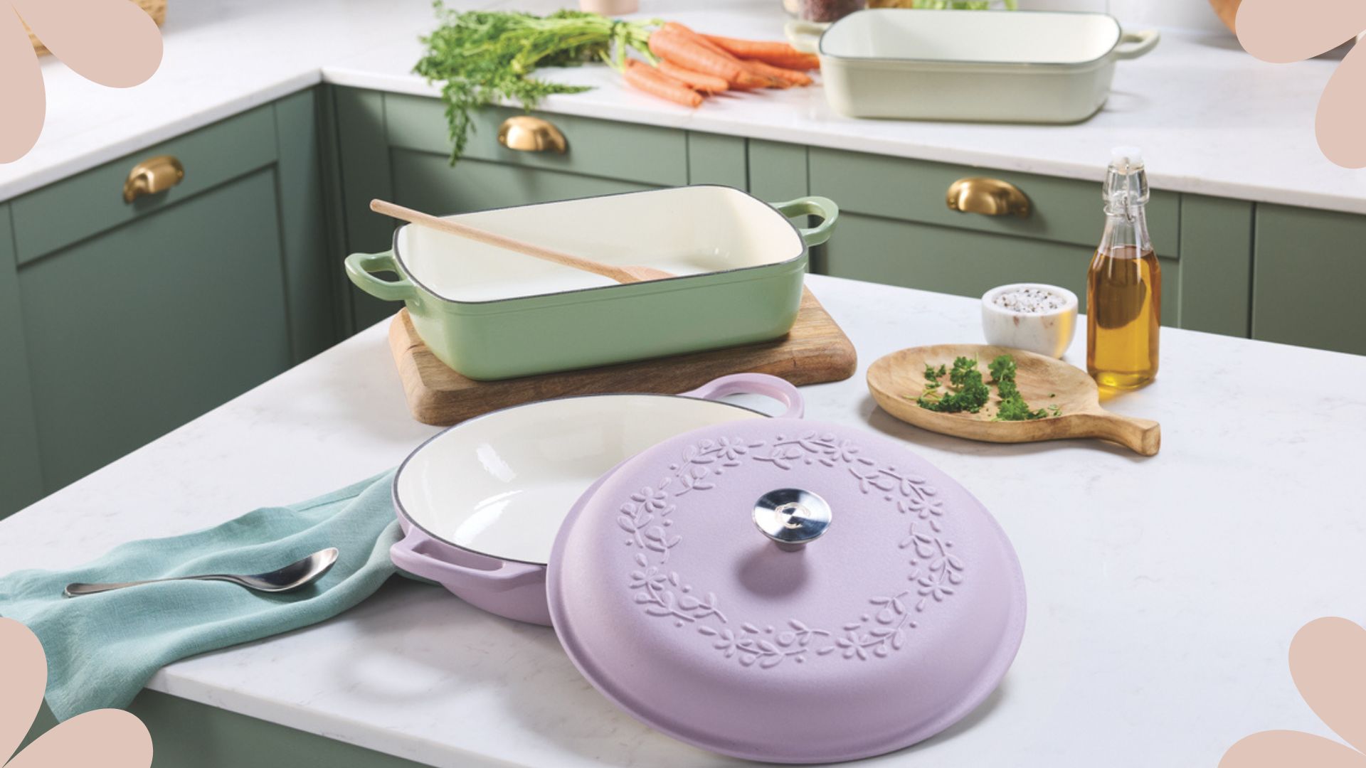 Green kitchen with white countertops showing the Aldi cast iron cookware in lilac and pastel green