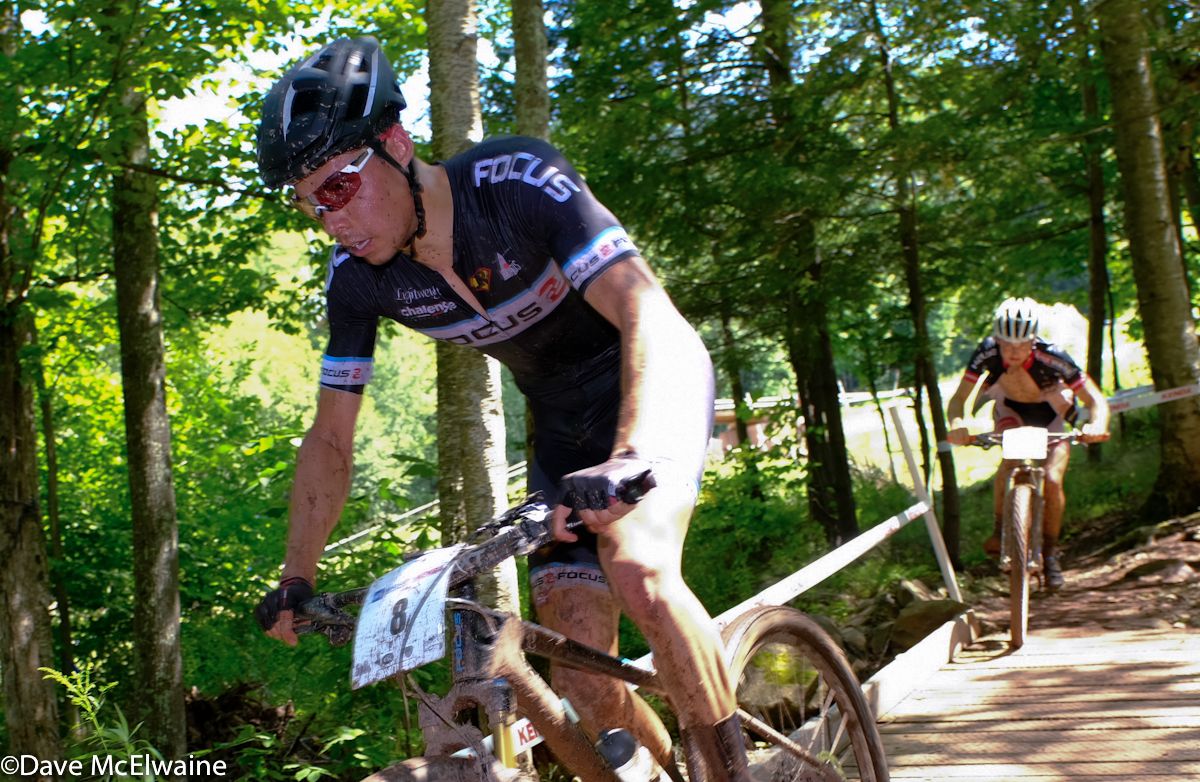 Jeremy Martin (Focus) crossing a bridge near the end of lap four