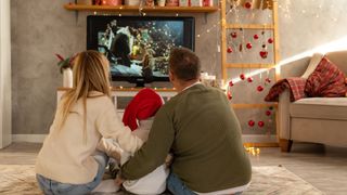 Family watching christmas movie together
