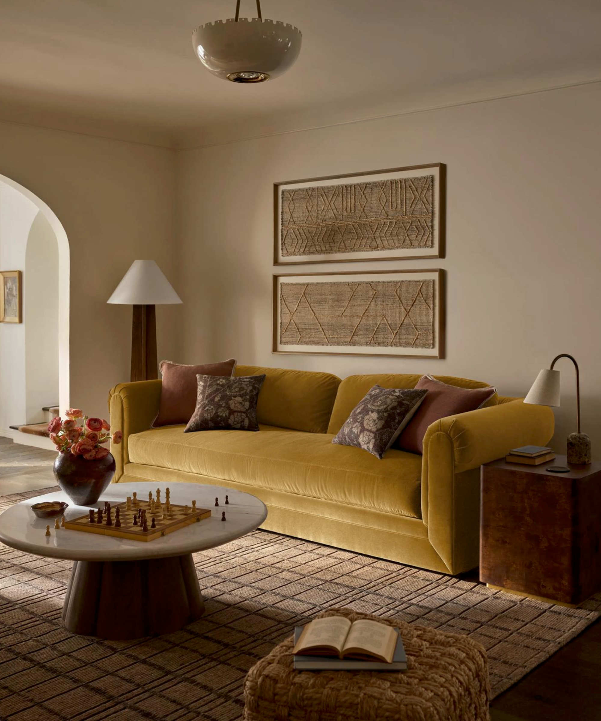 Warm cream living room with mustard roll arm sofa
