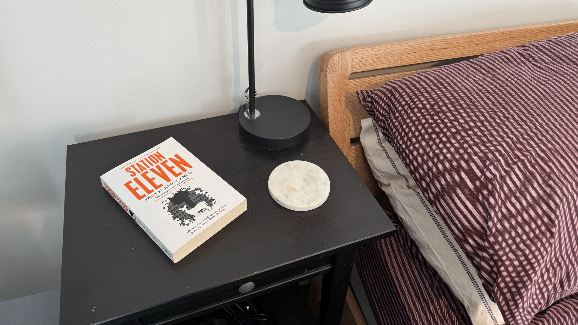 A decluttered side table in a bedroom