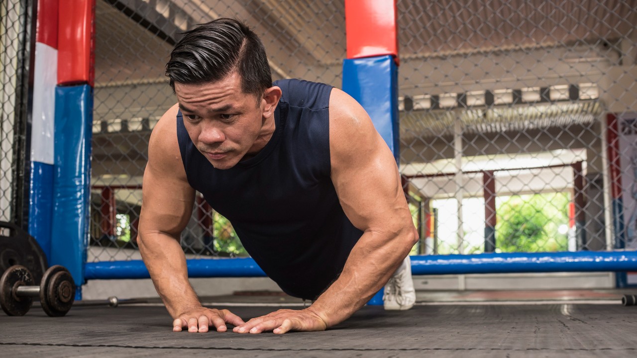 Man performs diamond press-up