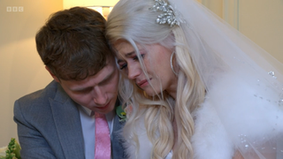 Jay Brown comforts a crying Lola Pearce in her wedding dress