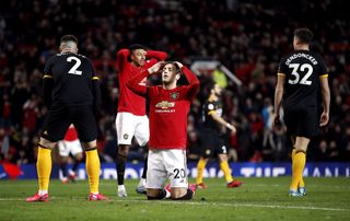 Diogo Dalot reacts to his late miss against Wolves