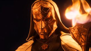 A Divinity character holds a torch to the screen