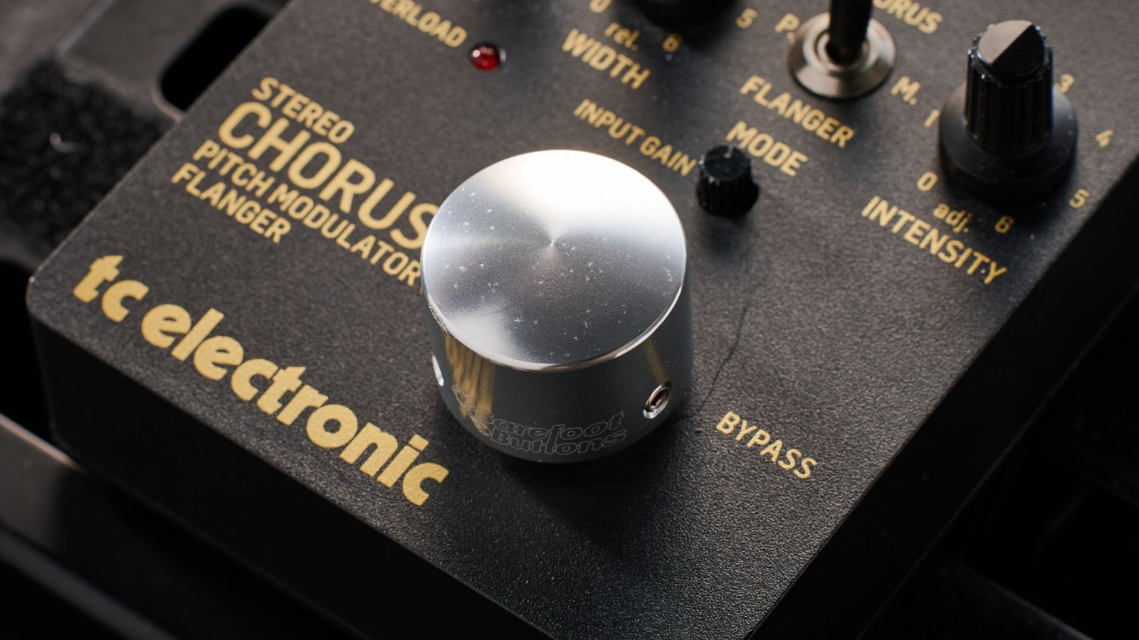 A silver footswitch topper on a TC Electronic Stereo Chorus pedal