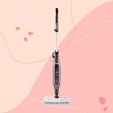 Shark Klik n Flip Automatic Steam Mop on a pink background