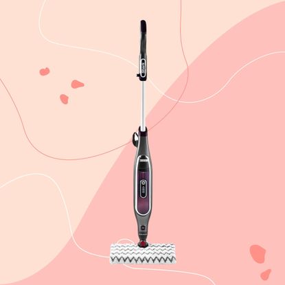 Shark Klik n Flip Automatic Steam Mop on a pink background