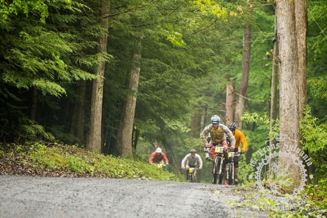 Justin Lindine leads the pack over the gritty wet roads.