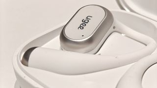Ugee FreSound; open earbuds on a white table