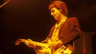 Paul McCartney, performing live onstage with Wings, playing Epiphone Casino guitar