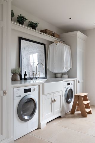 utility room shelving ideas with a rail above the sink in a white utility room