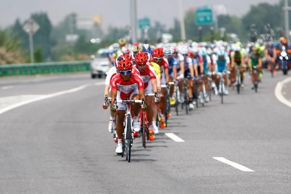 Heksa Prasetya of Malak Tianyoude Cycling Team lead the peloton