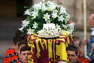 The coffin of Princess Diana, Princess of Wales, leaves Westminster Abbey after her funeral service