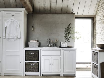 laundry room ideas white cabinets plastered wall by Neptune