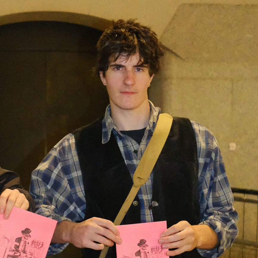 man in checked shirt and waistcoat