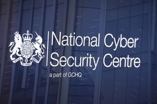 NCSC logo superimposed with a translucent background in front of an office building