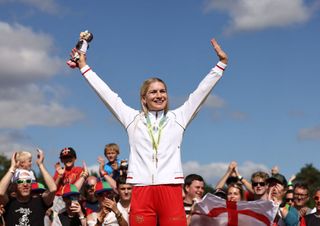 England's Evie Richards reacts with her gold medal during the medal presentation ceremony for the women's Cross country mountain bike event on day six of the Commonwealth Games at Cannock Chase Forest Cannock