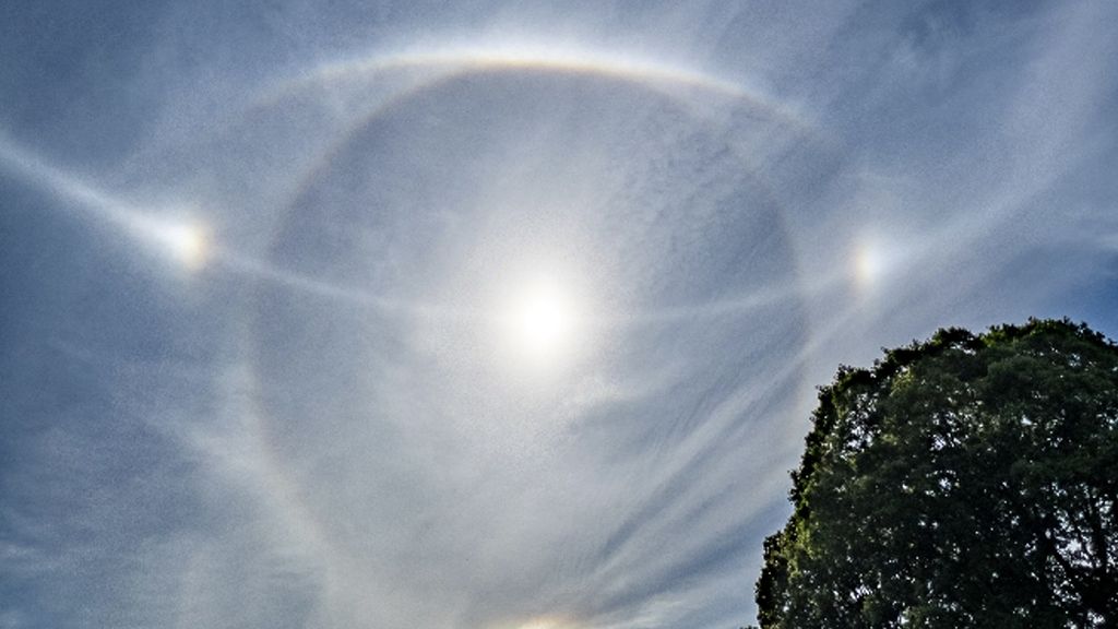 Ethereal 'halo' and light arcs around the sun captured in photos of