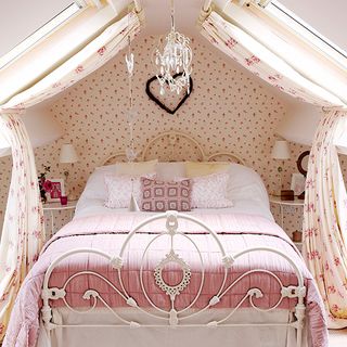 bedroom with curtains white bed designed wall and chandelier