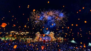 SHAORAO, CHINA - OCTOBER 08: Thousands of lanterns and fireworks light up the night sky over Gexian Village on October 8, 2025 in Shangrao, Jiangxi Province of China. These recyclable electronic lanterns, lifted by helium, create a dazzling display that is both eco-friendly and captivating.