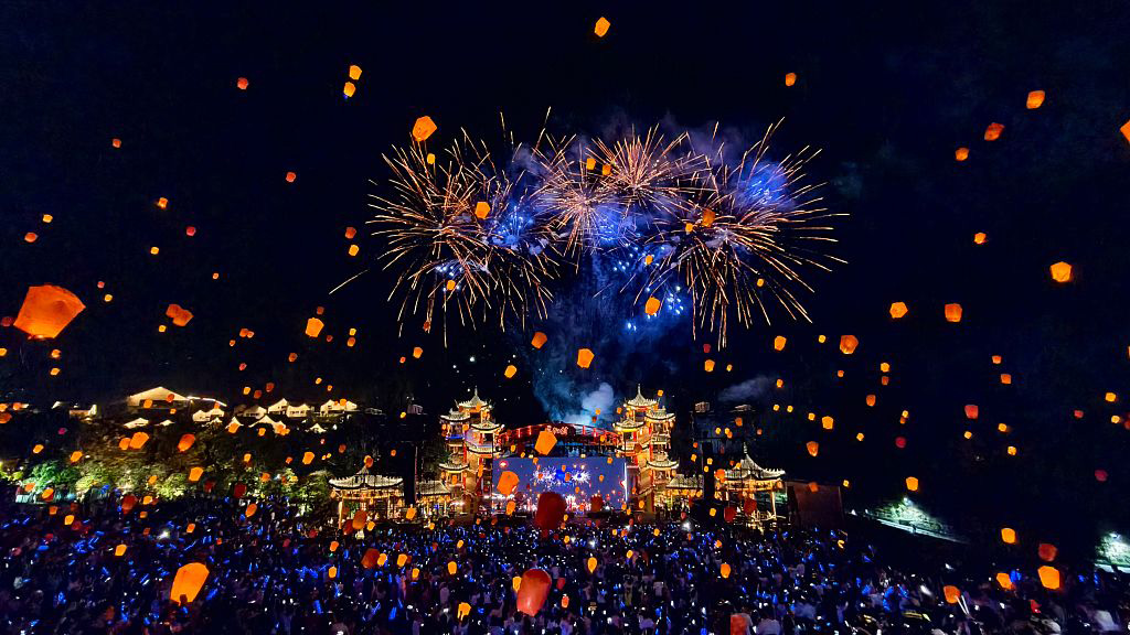 SHAORAO, CHINA - OCTOBER 08: Thousands of lanterns and fireworks light up the night sky over Gexian Village on October 8, 2025 in Shangrao, Jiangxi Province of China. These recyclable electronic lanterns, lifted by helium, create a dazzling display that is both eco-friendly and captivating. 