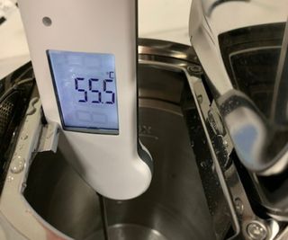 An electric thermometer measuring the temperature of the water in the Aarke kettle.