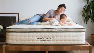 A mother and baby lying on an Avocado Green mattress