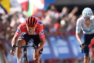 Team Quick Steps Belgian rider Remco Evenepoel L rides and crosses the finish line during the 18th stage of the 2022 La Vuelta cycling tour of Spain a 192 km race from Trujillo to Alto del Piornal on September 8 2022 Photo by OSCAR DEL POZO AFP Photo by OSCAR DEL POZOAFP via Getty Images