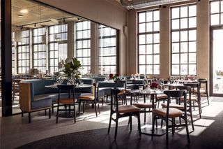 experiential brand design chairs and a mirrored wall in a hotel