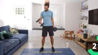 A screenshot from The Body Coach dumbbell workout