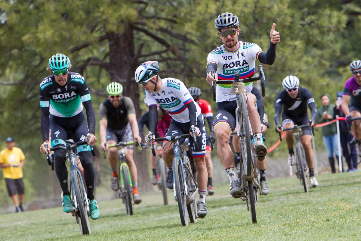 Peter Sagan wheelies as he crosses the finish line of the Sagan Fondo
