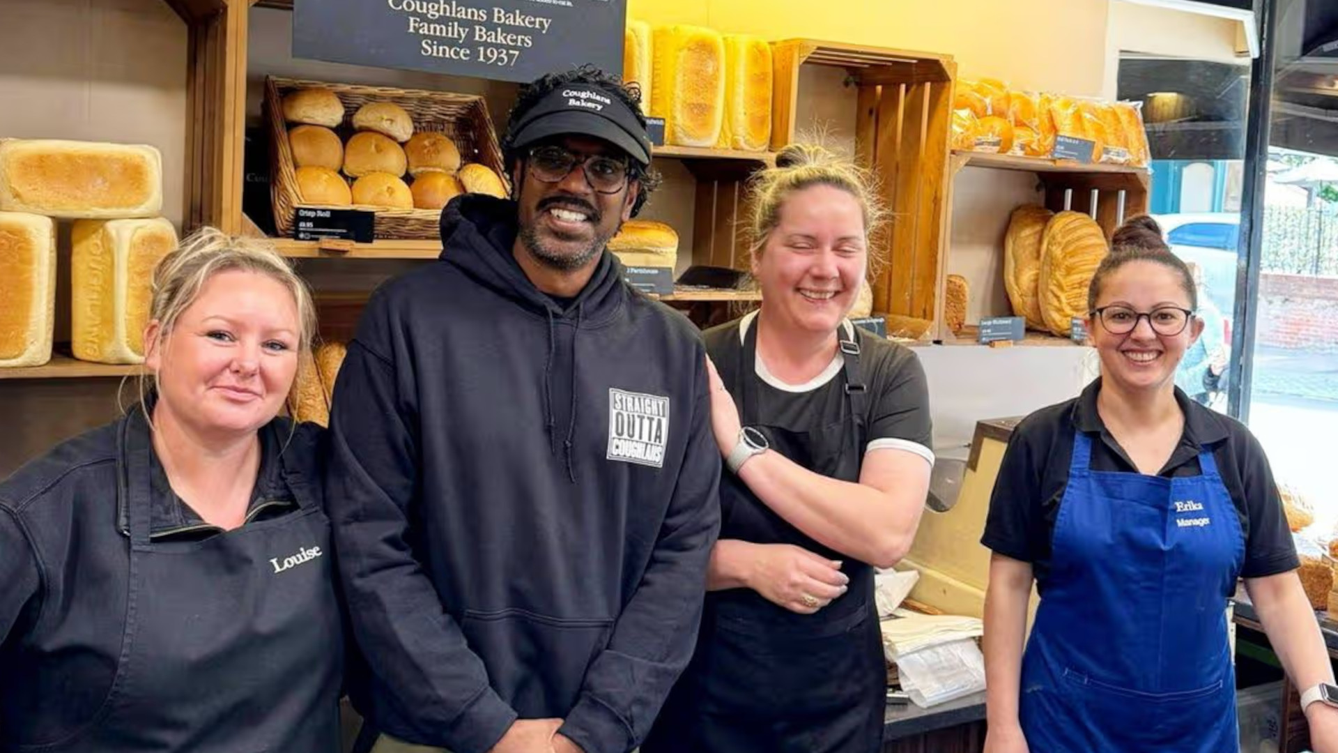 A photo of Coughlans Bakery staff and Romesh Ranganathan.