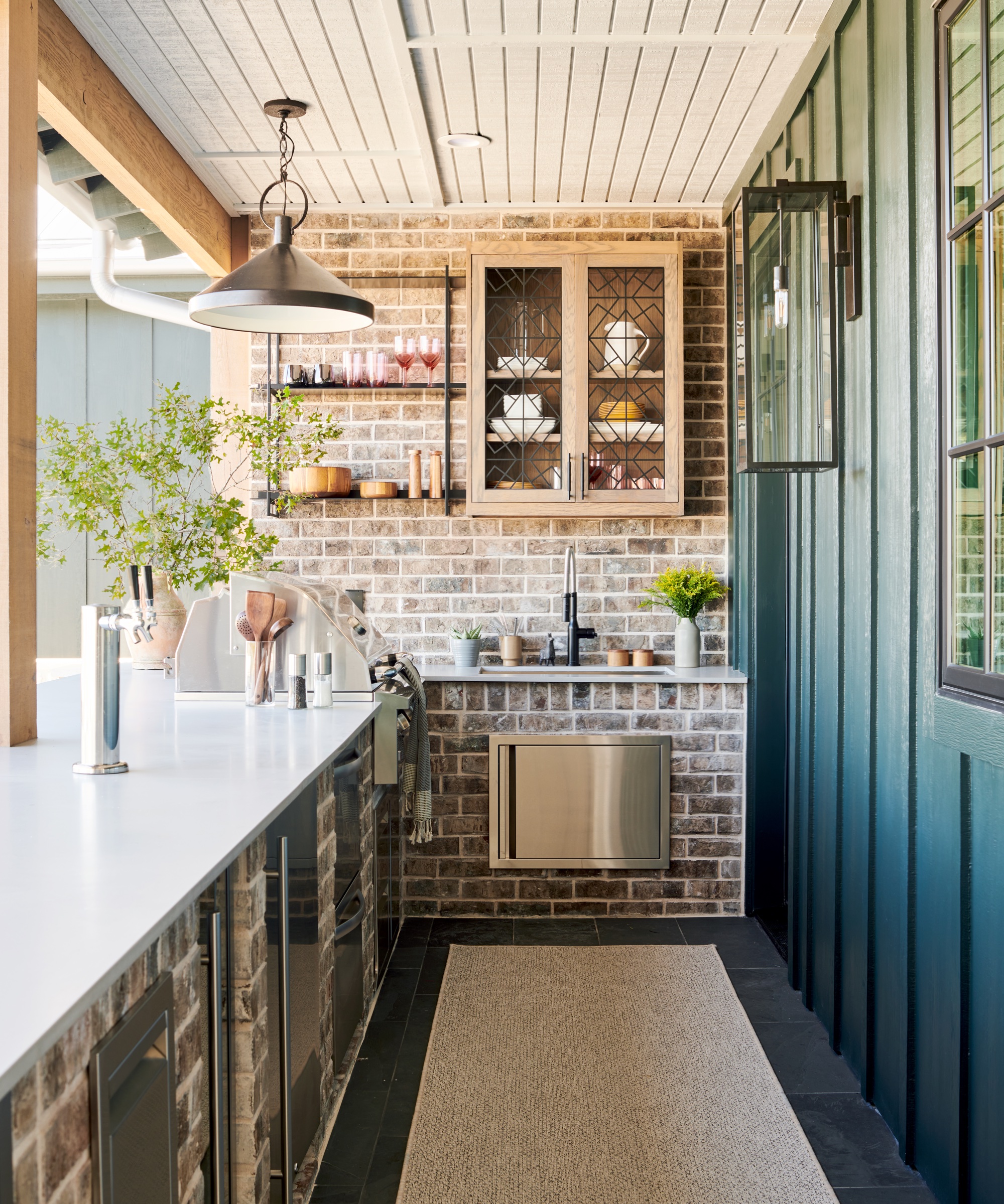 outdoor kitchen with outdoor sink and outdoor oven by LH. Designs