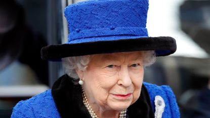 the queen in blue hat