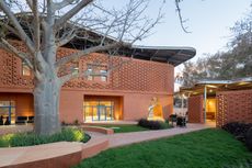 Goethe-Institut Dakar, brown earth block forms with wavy roofs designed by Francis Kere