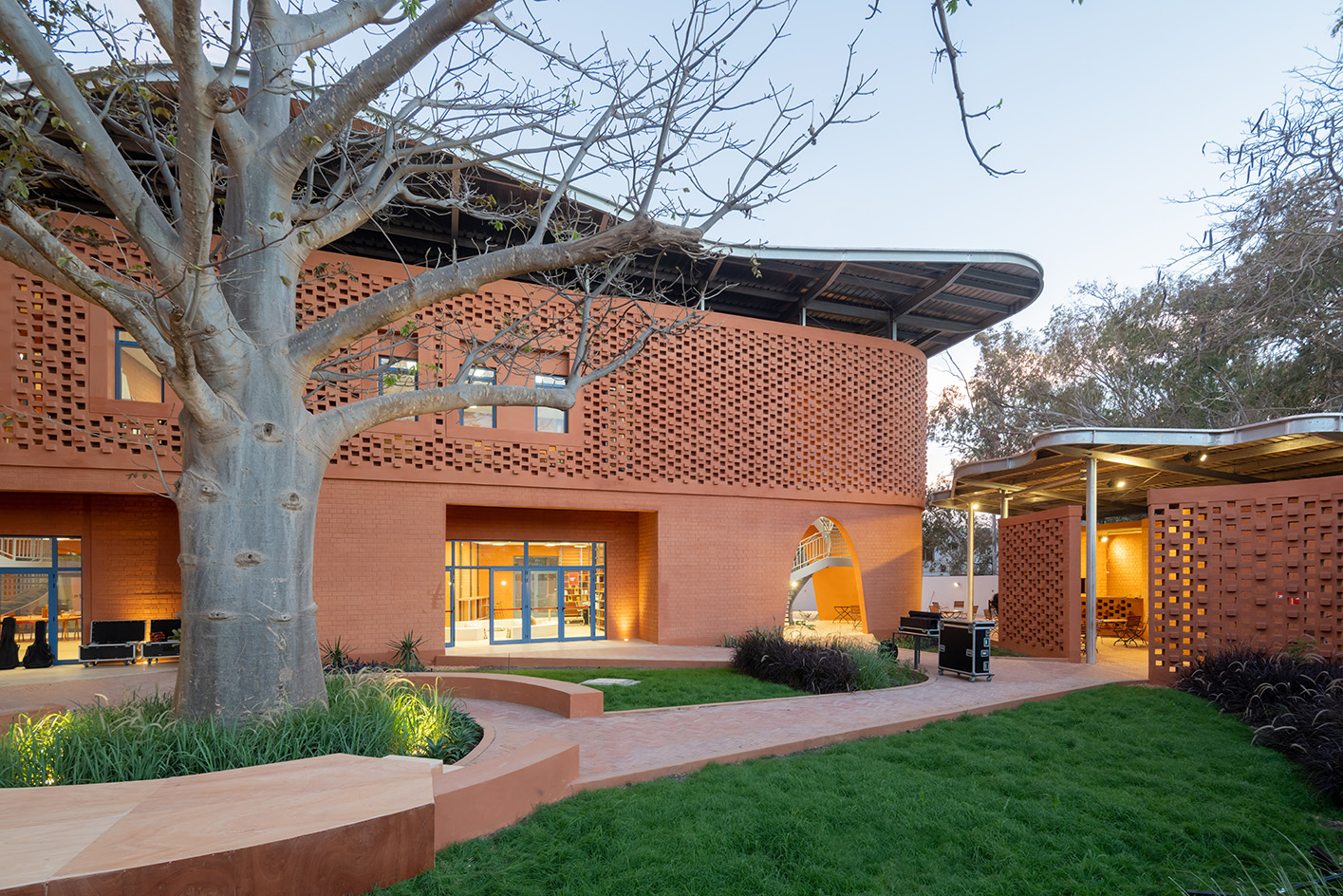 Goethe-Institut Dakar, brown earth block forms with wavy roofs designed by Francis Kere
