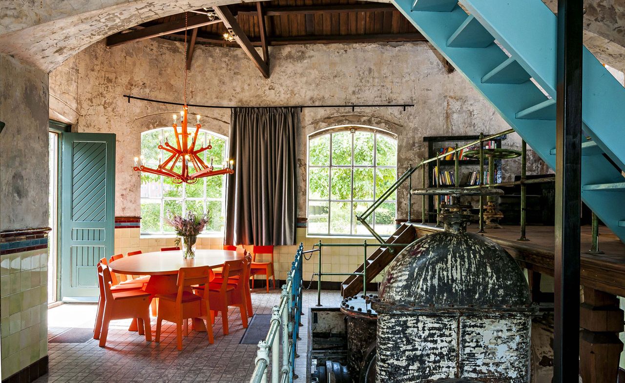 Dining table, stairs, doorway and a window