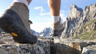 best hiking boots: close up of hiking boots on trail
