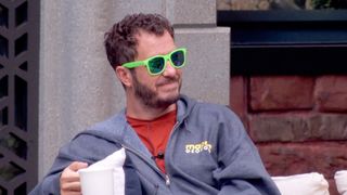 Rick enjoying a cup of coffee and rocking some sunglasses