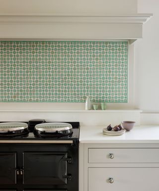 White kitchen by Martin Moore with range cooker and green splashback